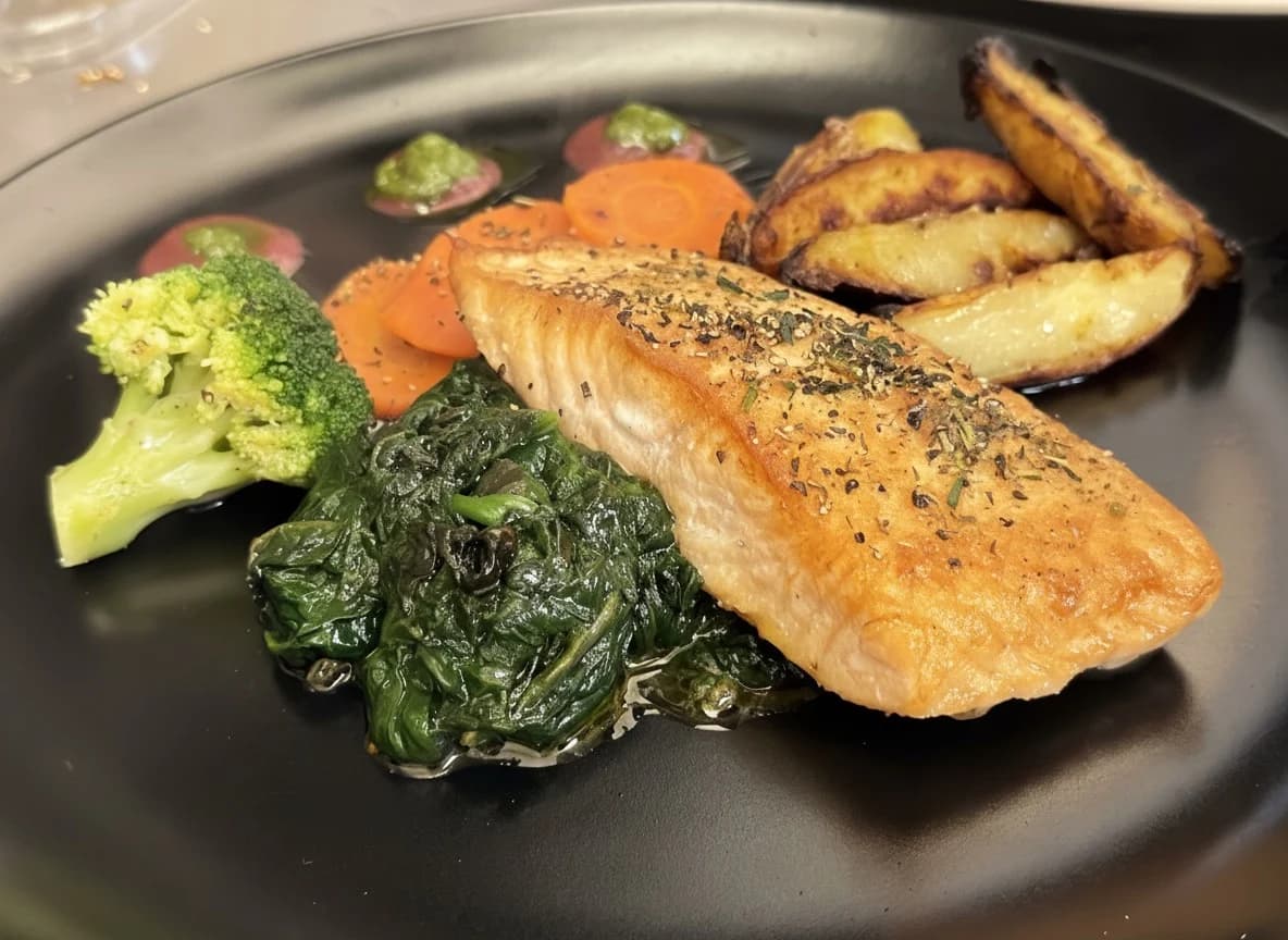 Pan fried salmon fillet with spinach and potatoes at Pavillon